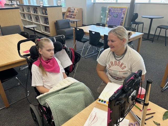 Peer tutors and the Life Skills Students in the media center 