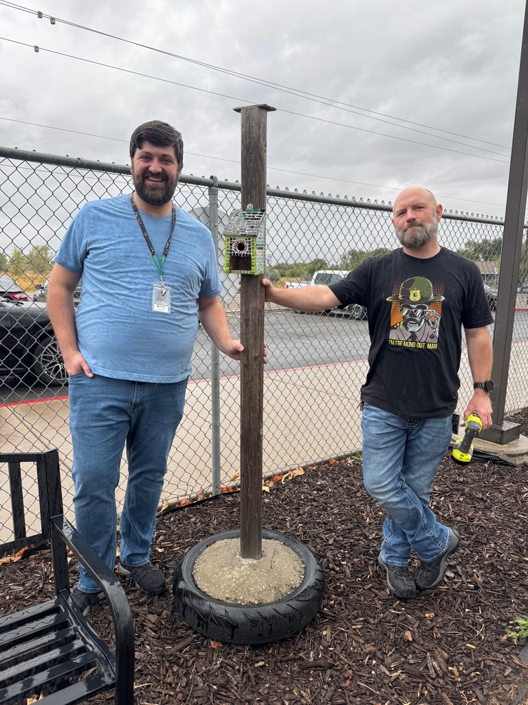 Mr Brad and Randy installing mosaic bird house.