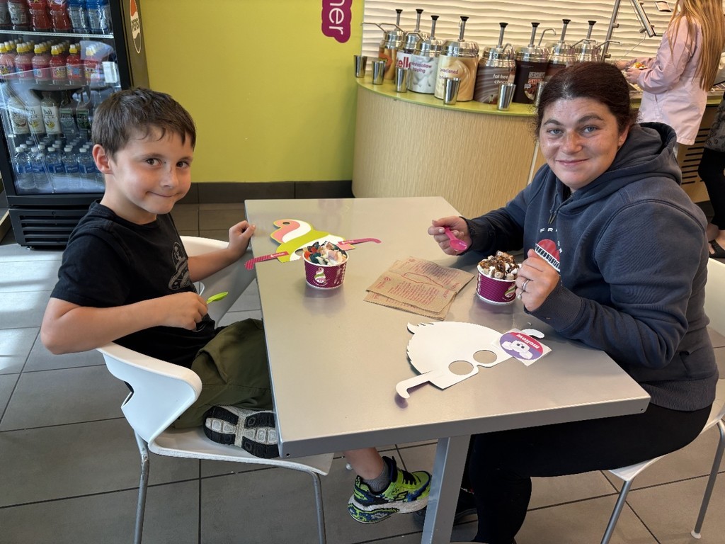 boy and mom eating yogurt