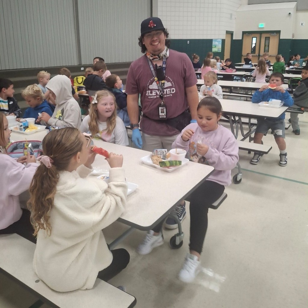 Mr. Z and kids eating lunch.