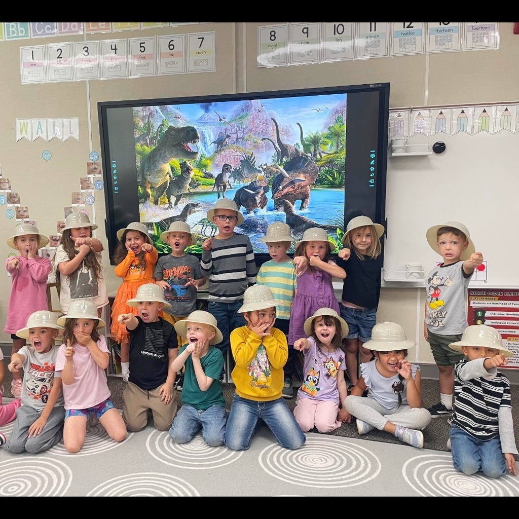 Kindergarten students participating in a dino scavenger hunt.