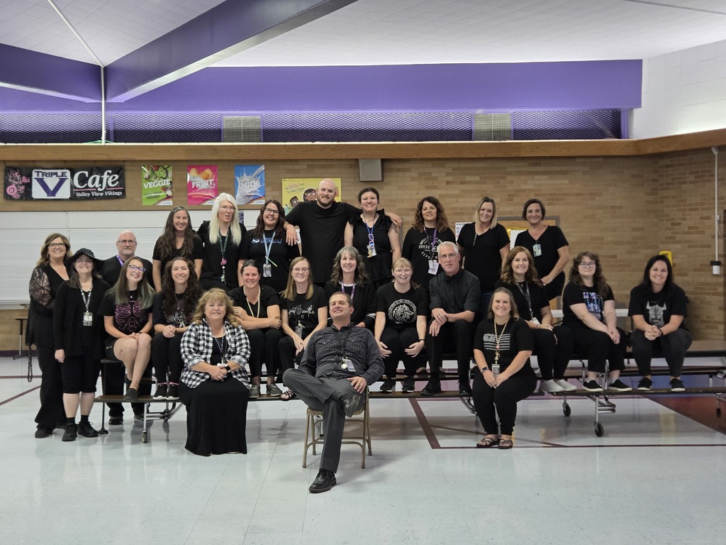 Faculty and staff all dressed in black for underground spirit day.