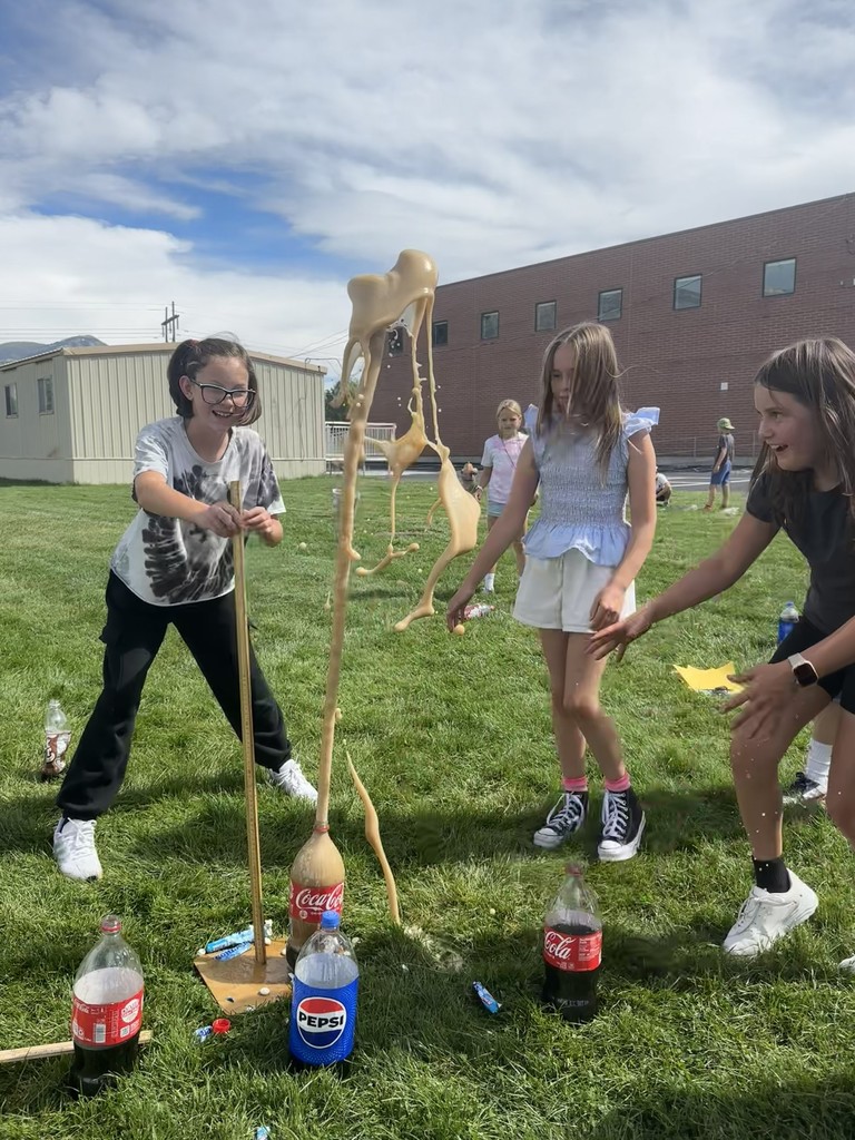 Students experimenting with soda and mentos