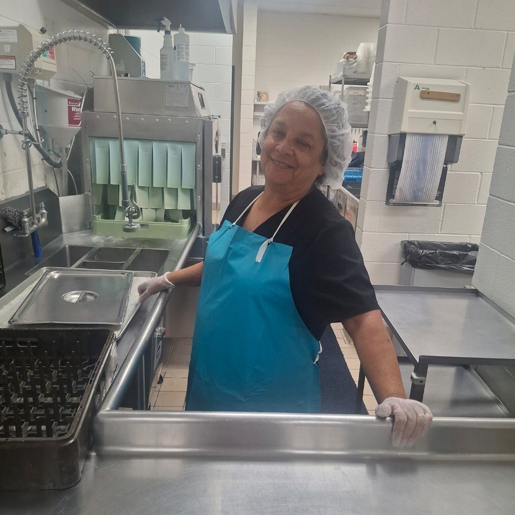 Lorrie Johnson washing dishes