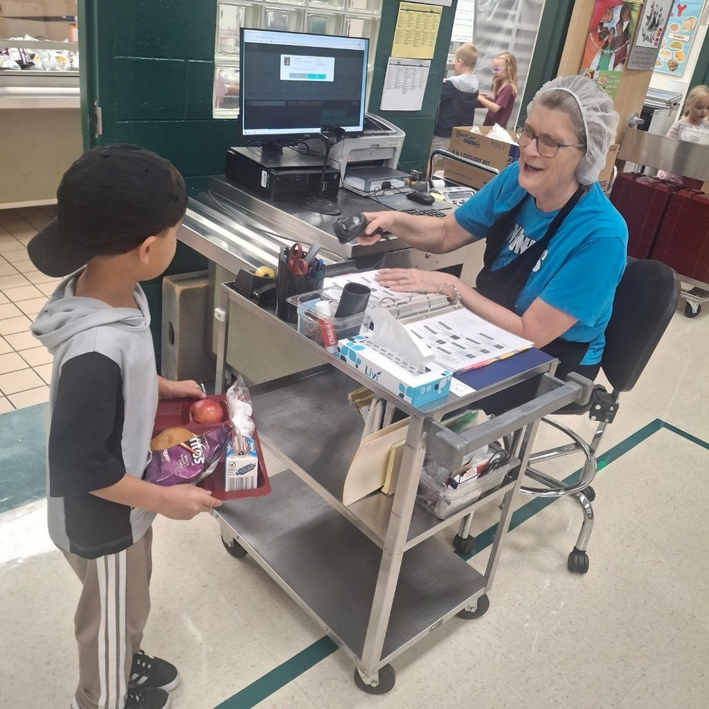 Nora recording a boy's lunch