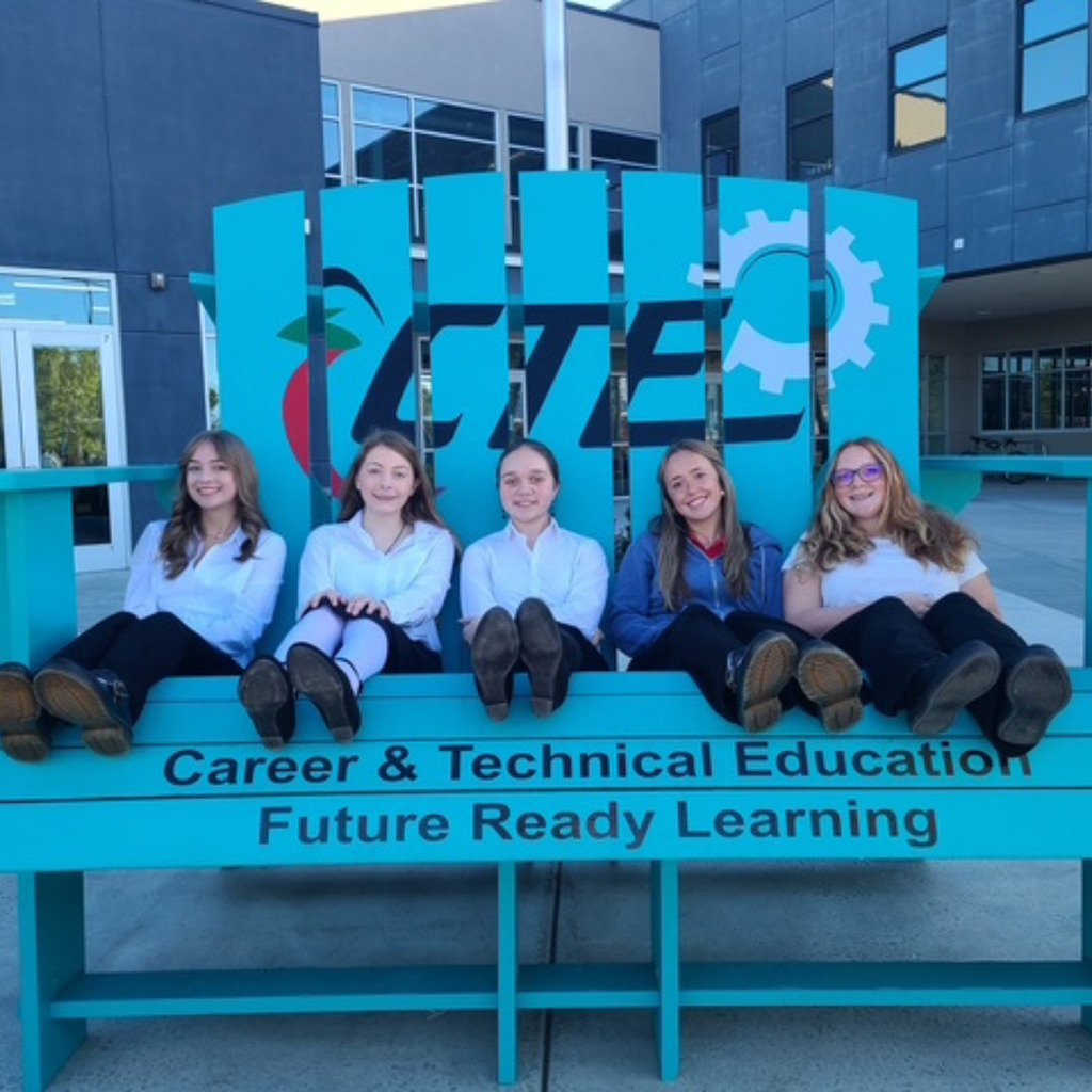 photo of roy jr fccla leadership in a giant blue CTE (Career & Technical Education) chair Future Ready Learning