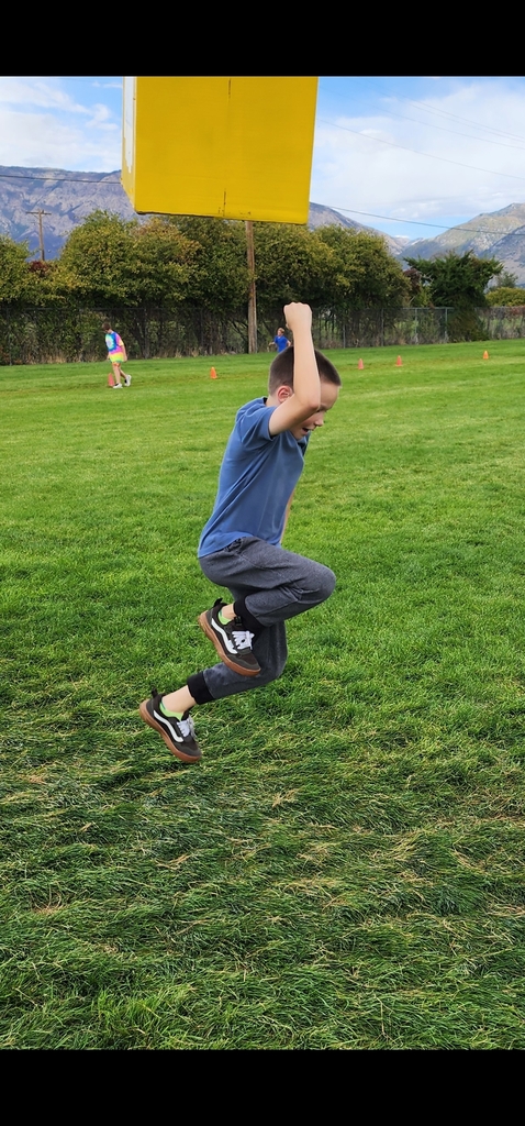 Student jumping and hitting a box