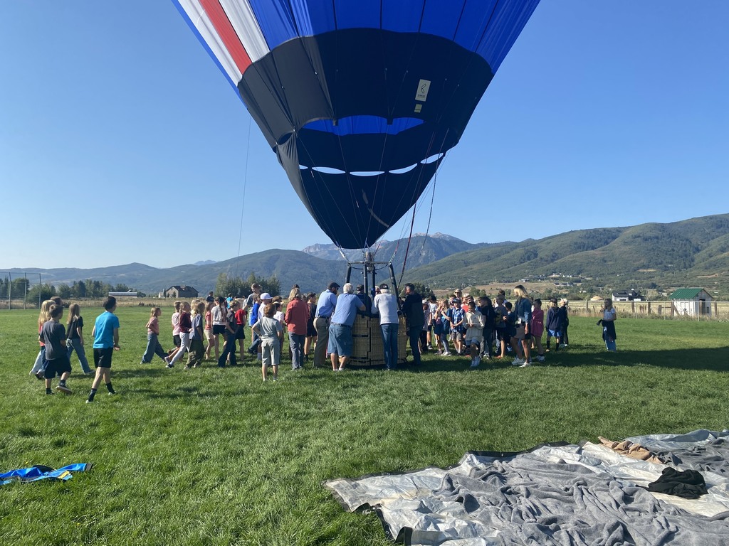 Photo of students and teachers with hot air balloon.
