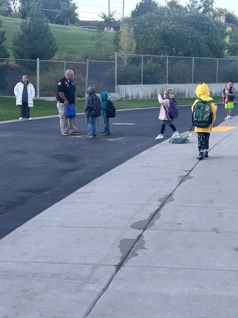 Students walking to school on Walk to School Day for Green Ribbon Week.