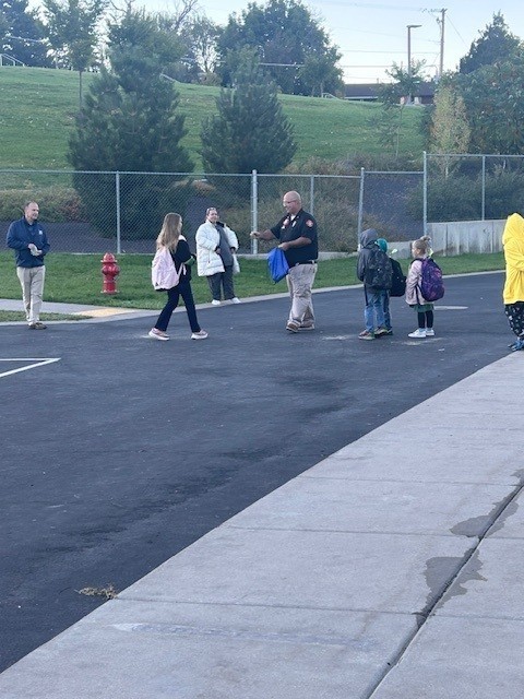 Students walking to school on Walk to School Day for Green Ribbon Week.