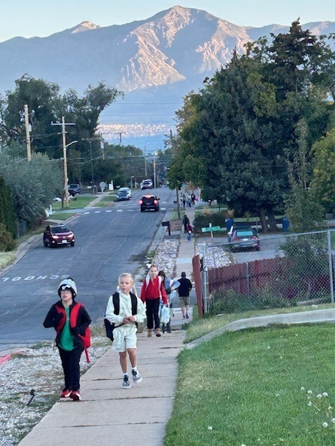 Students walking to school on Walk to School Day for Green Ribbon Week.