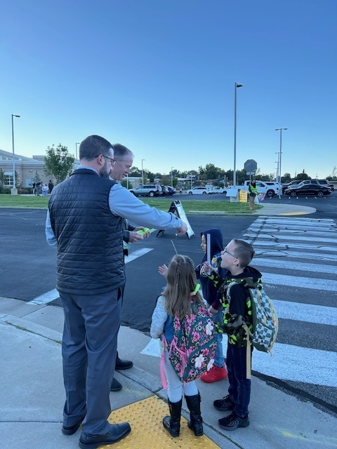 Students walking to school on Walk to School Day for Green Ribbon Week.