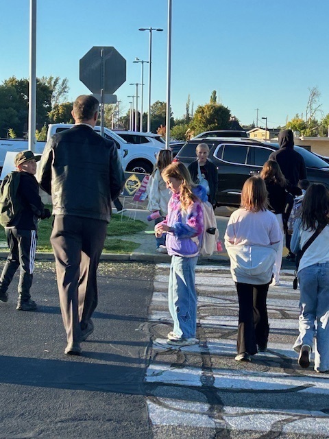 Students walking to school on Walk to School Day for Green Ribbon Week.