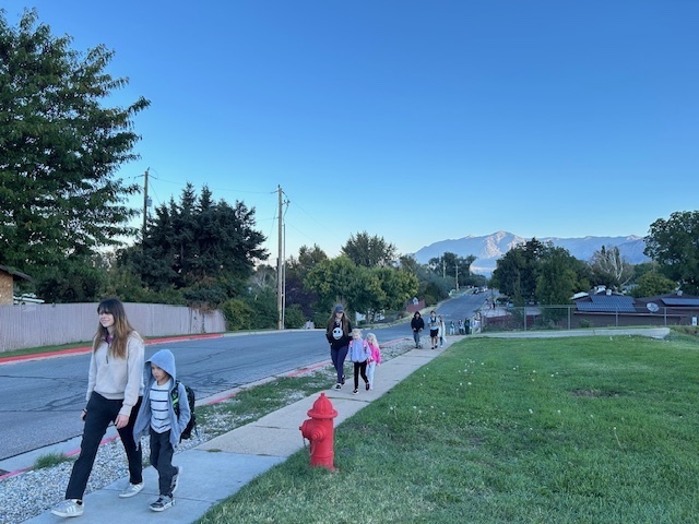 Students walking to school on Walk to School Day for Green Ribbon Week.