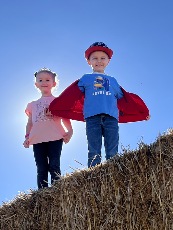 Kids on a hay bale