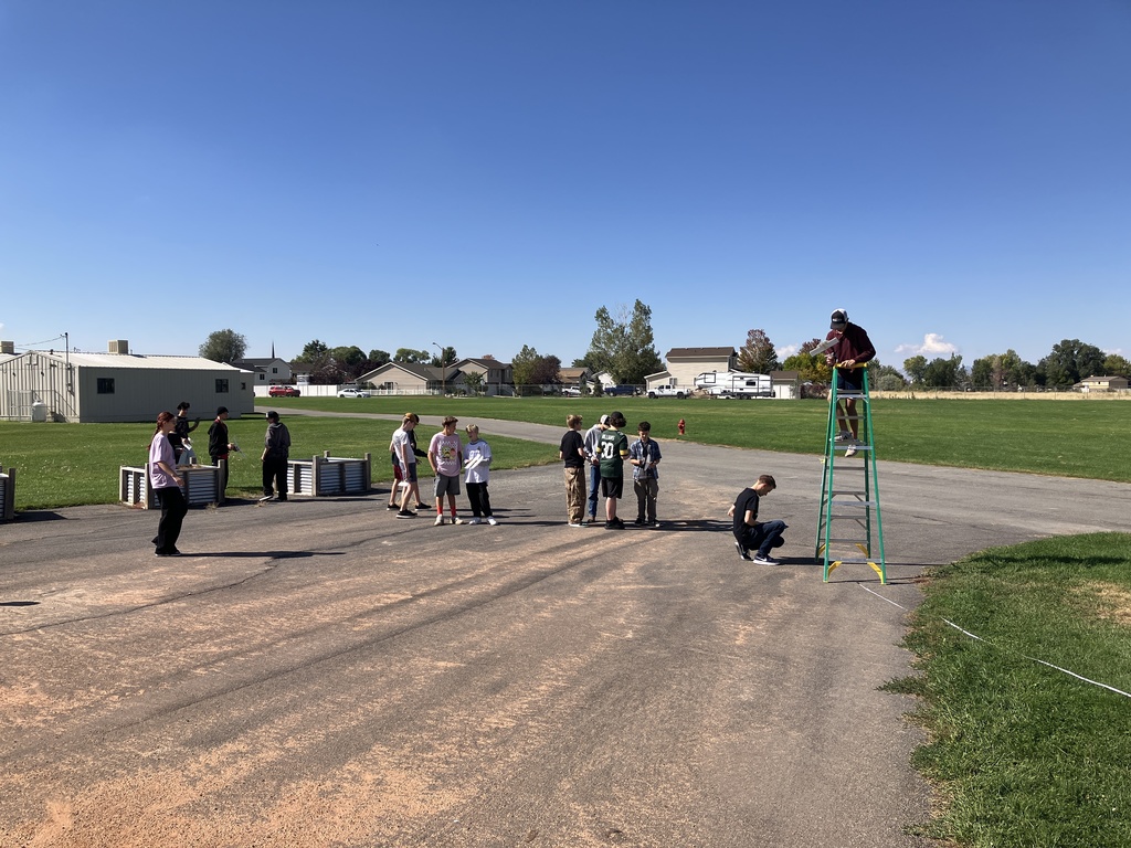 Students spent over a week trying to build a successful rubber-band powered glider that could fly 50ft. As we finished up the unit on Heavier-than-Air travel. In the unit, they were learning about the forces and breakthroughs humankind had to make for this kind of flight to be possible. This is what flight day looked like as they gathered their data.