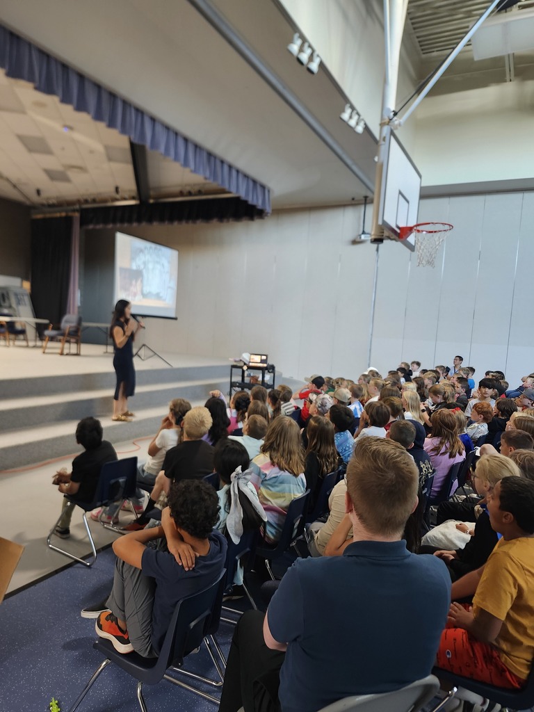 Kids listening to the Author Emily Inouye Huey during an assembly!