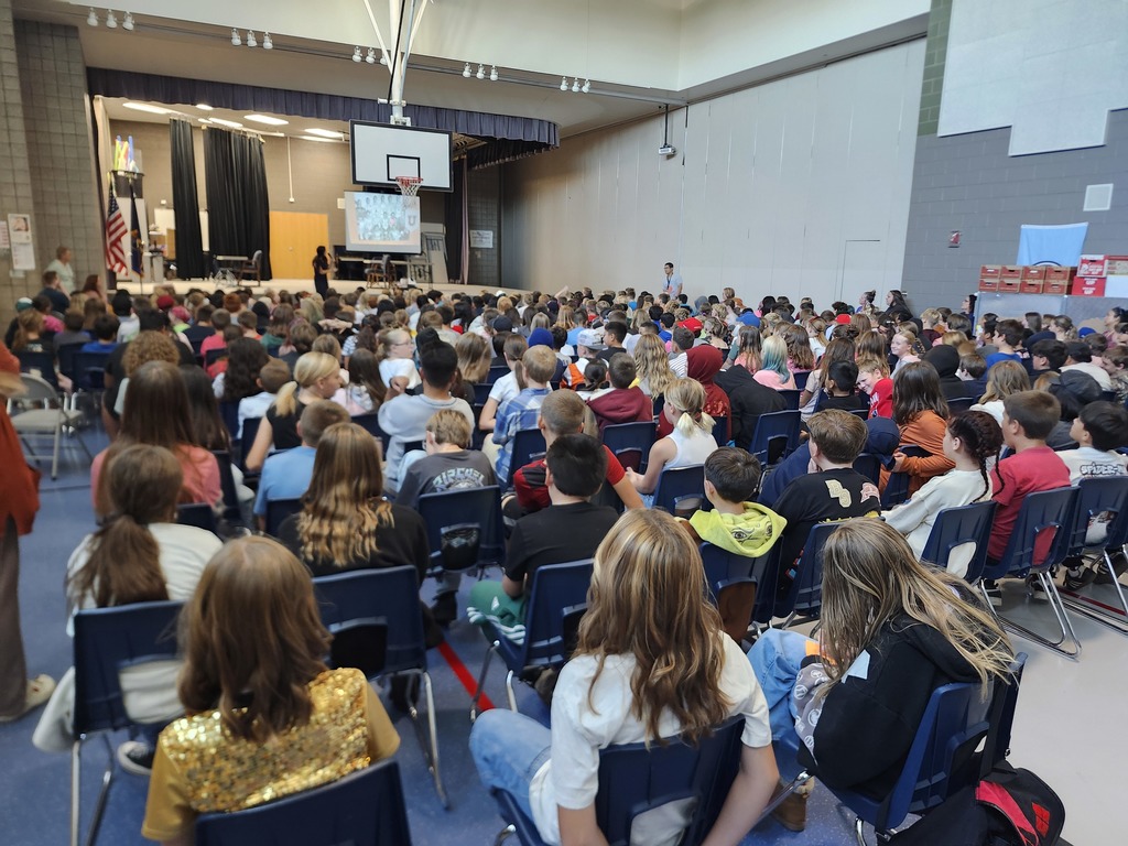 Kids listening to the Author Emily Inouye Huey during an assembly!