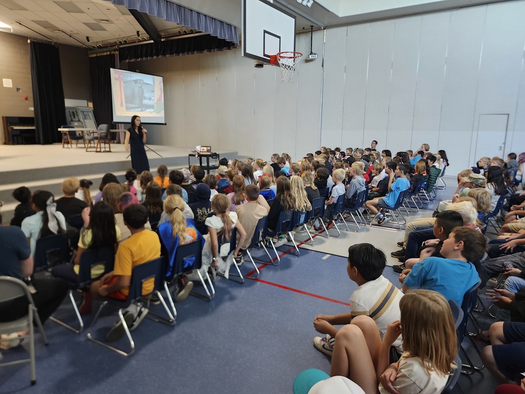 Kids listening to the Author Emily Inouye Huey during an assembly!