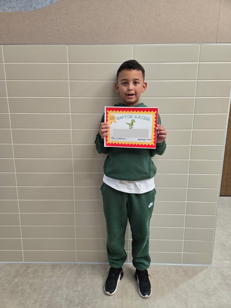 1 student standing with their raptor success award