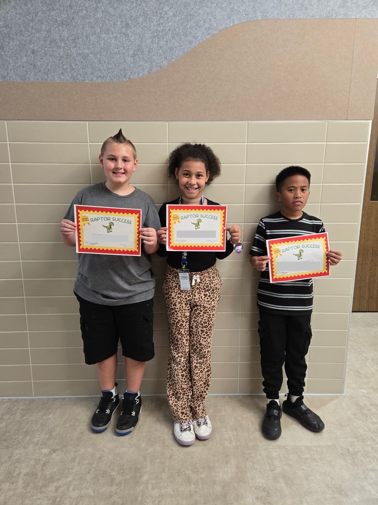 3 students standing with their raptor success awards
