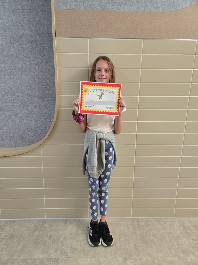 1 student standing with their raptor success award