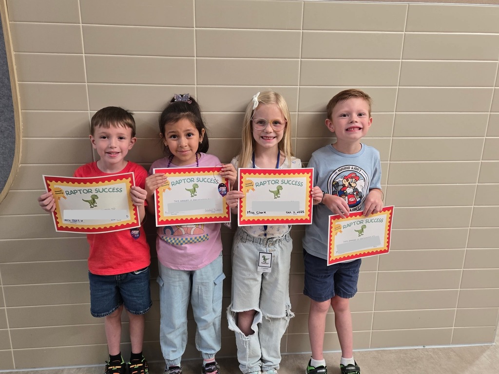 4 students standing with their awards