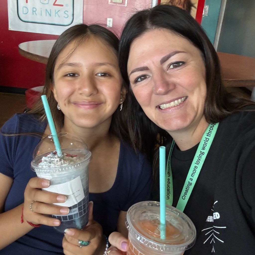Mrs. Jacobsen and a girl enjoying a drink at Fiz