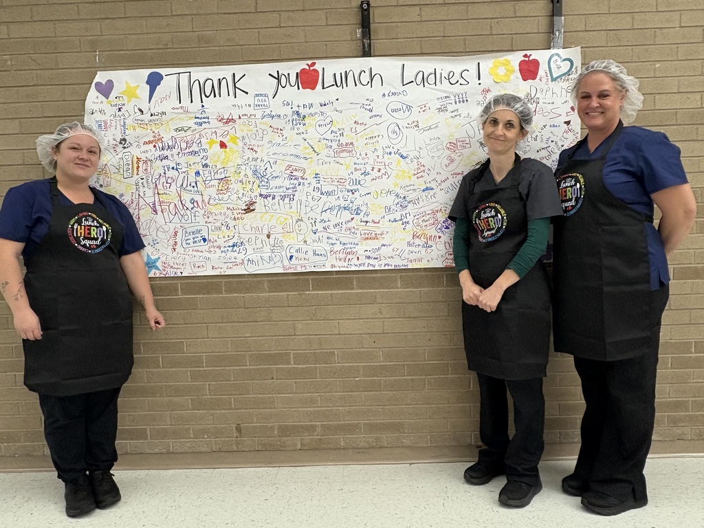 Thank You Lunch Ladies Banner with lunch ladies standing in front of it!