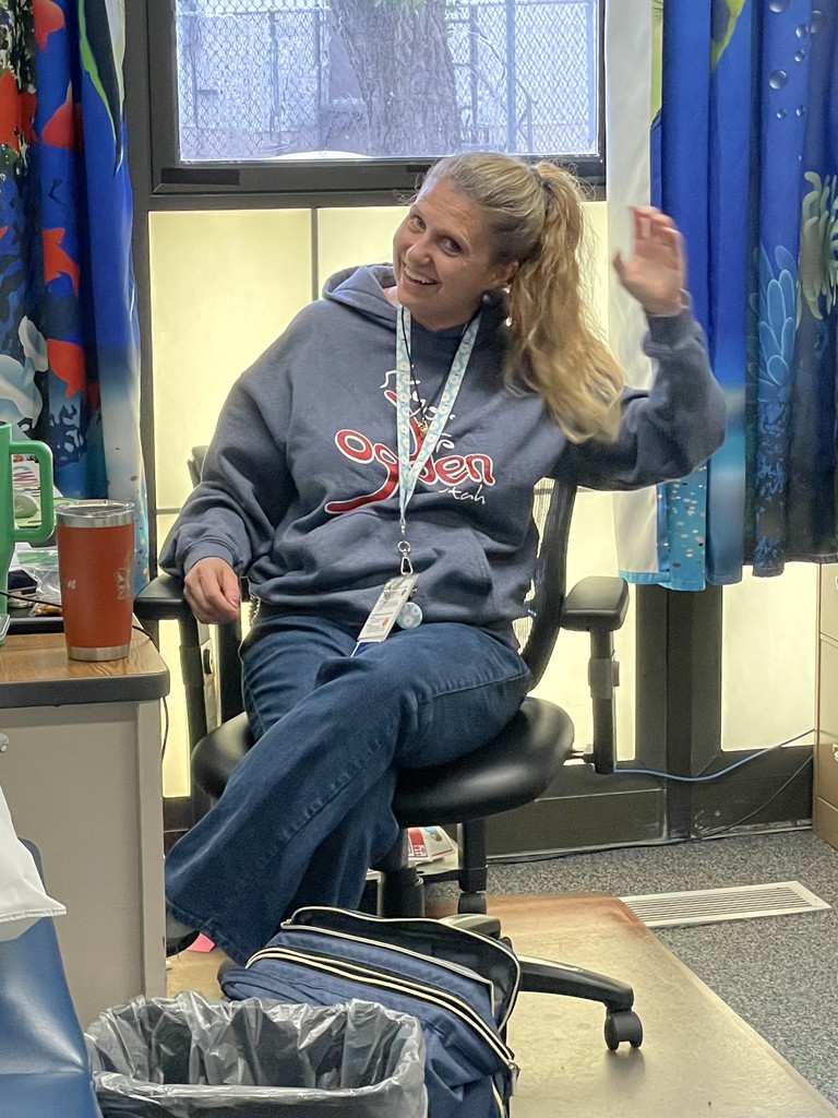 Meghan waiting in her office to help.