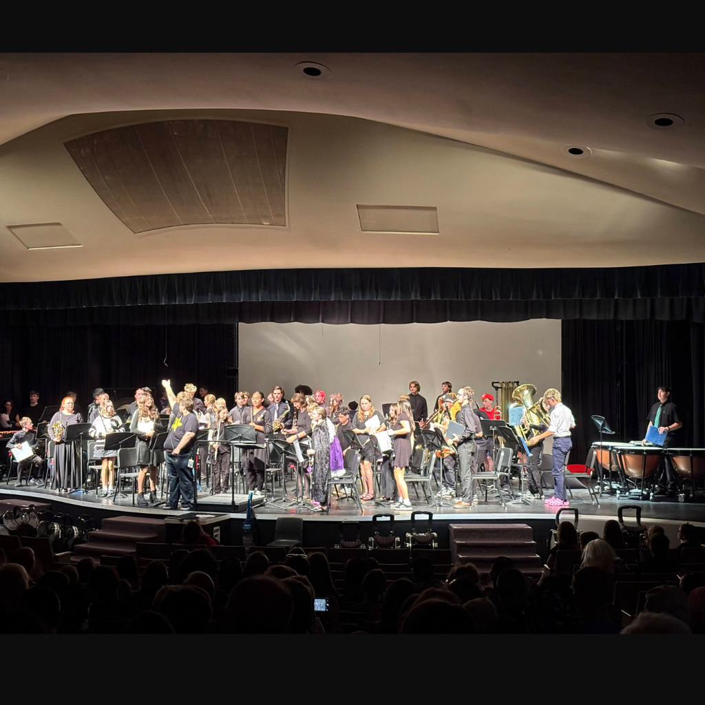 Photos of band playing in their band concert at Roy High Auditorium