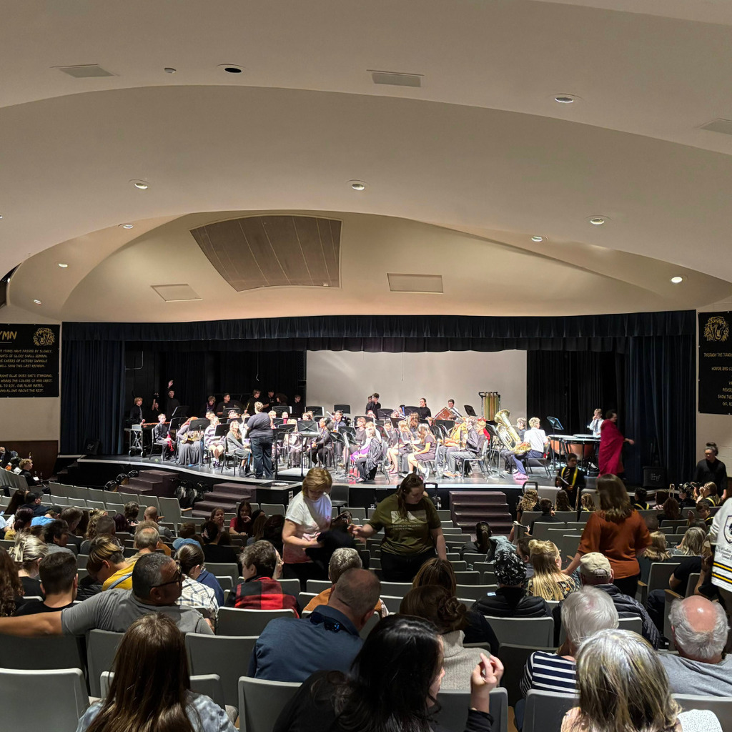 Photos of band playing in their band concert at Roy High Auditorium