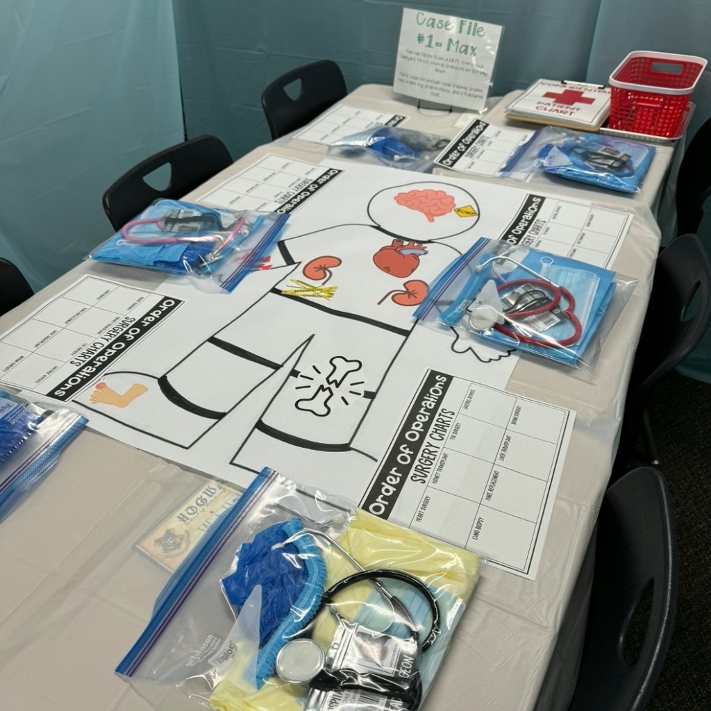 table with a pretend patient and medical supplies