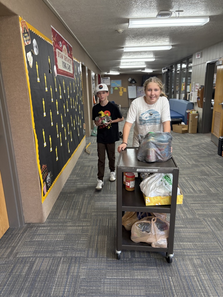 Students moving food for our food drive