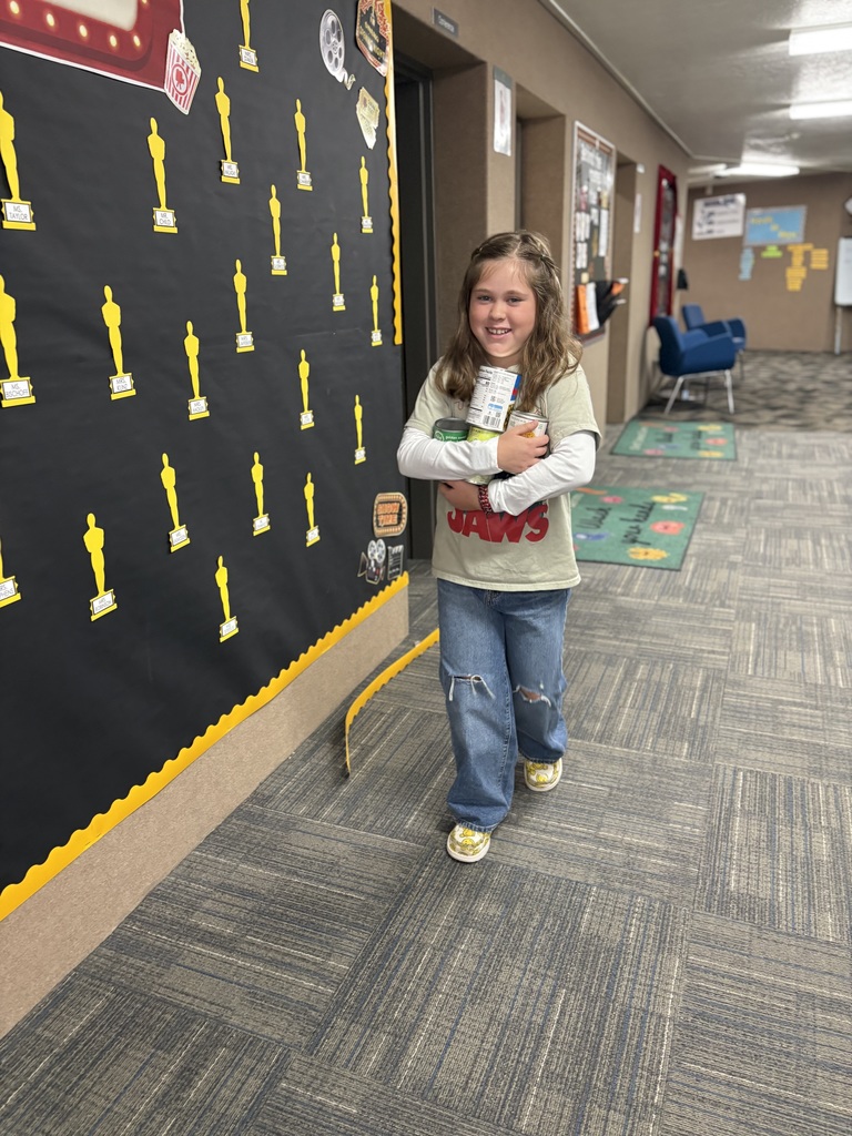 Student carrying food for our food drive