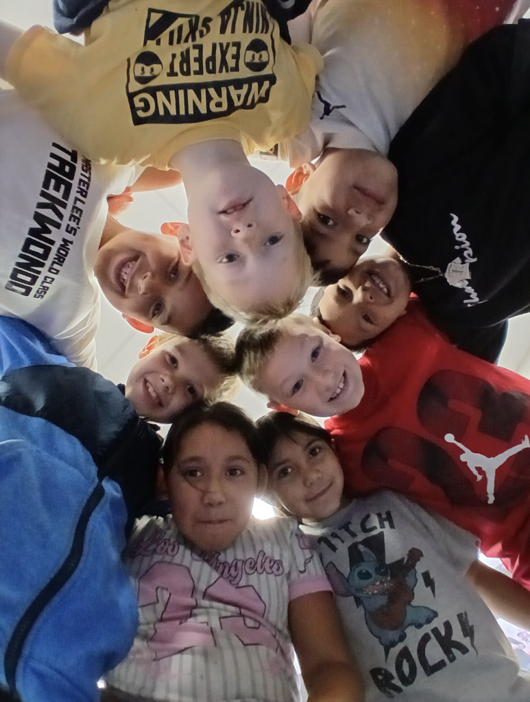 students together in a group with smiling faces.