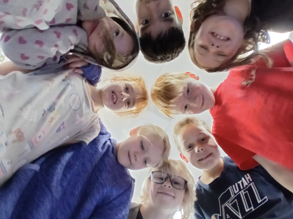 students together in a group with smiling faces.