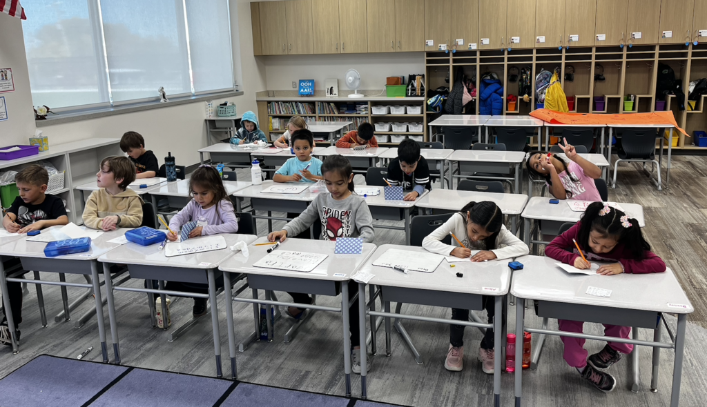 students sitting at their desks working in their classroom