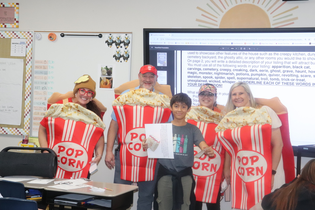 popcorn posse handing out shout outs to students
