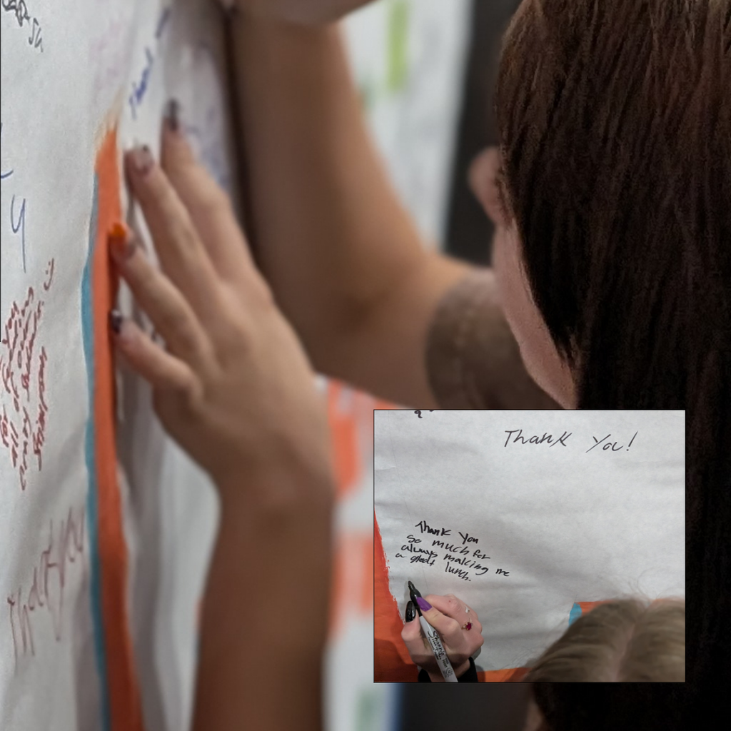 photographs of students signing our we love our lunch ladies sign