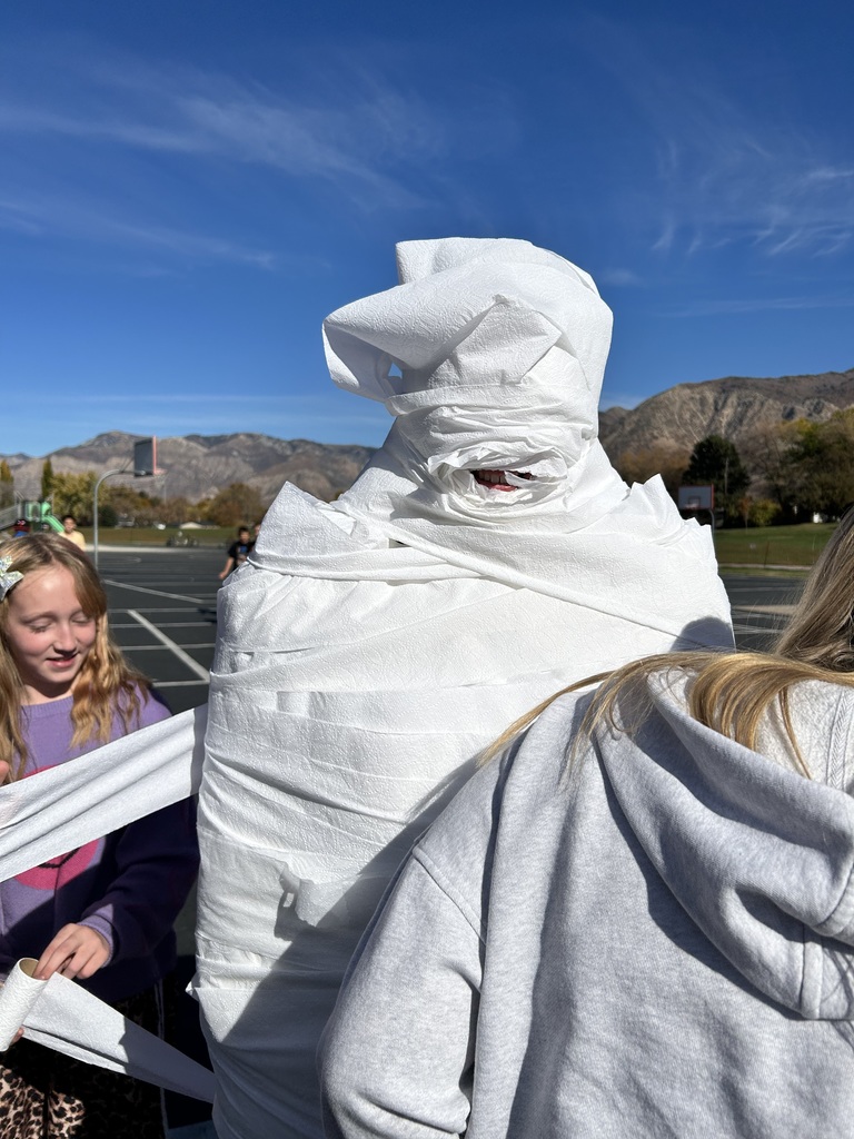 Students participating in the mummy wrap incentive. 