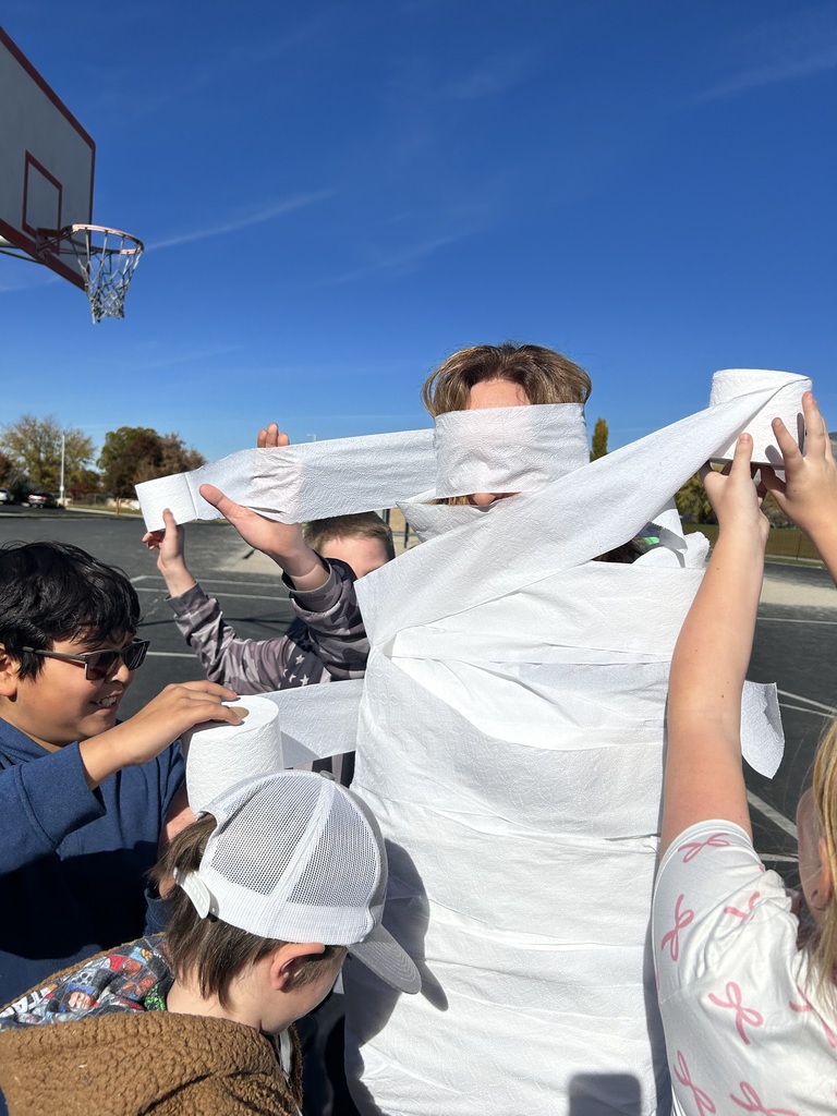 Students participating in the mummy wrap incentive. 