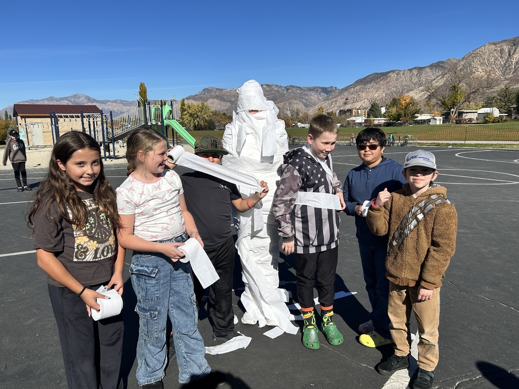 Students participating in the mummy wrap incentive. 