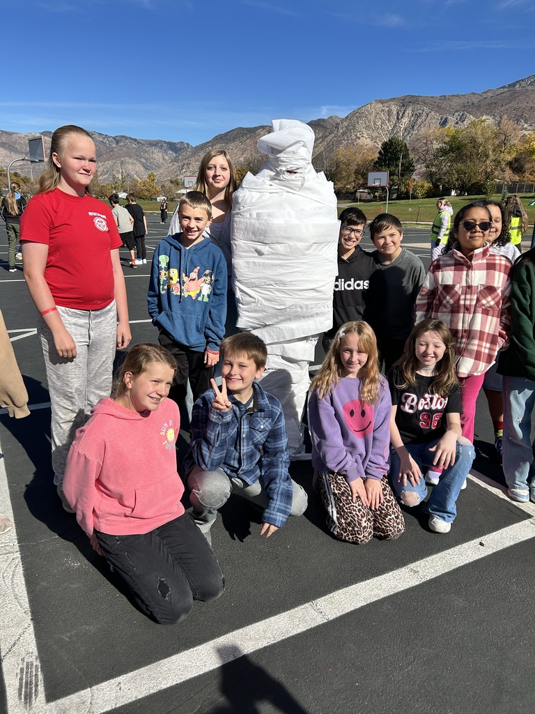 Students participating in the mummy wrap incentive. 