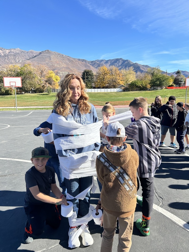 Students participating in the mummy wrap incentive. 