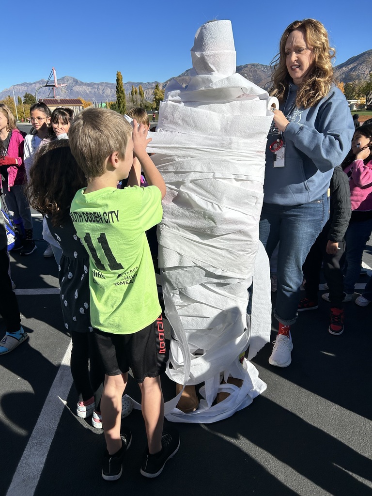 Students participating in the mummy wrap incentive. 