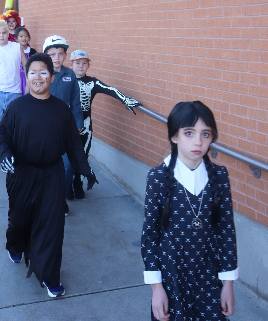 students and faculty at Halloween parade