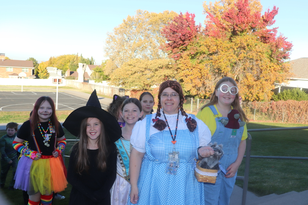 students and faculty at Halloween parade