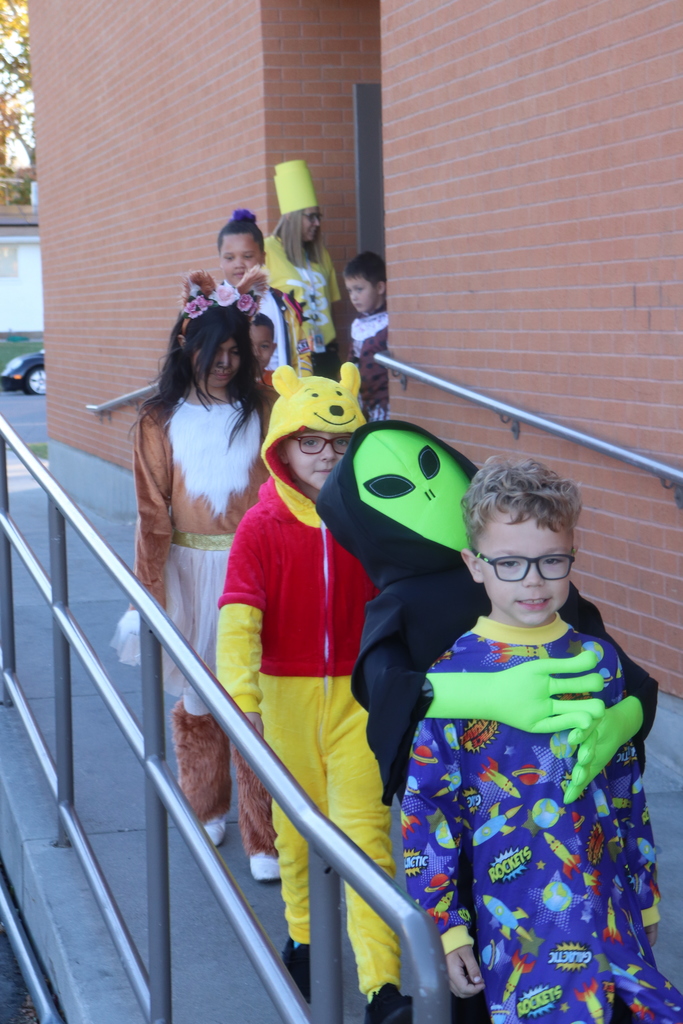 students and faculty at Halloween parade