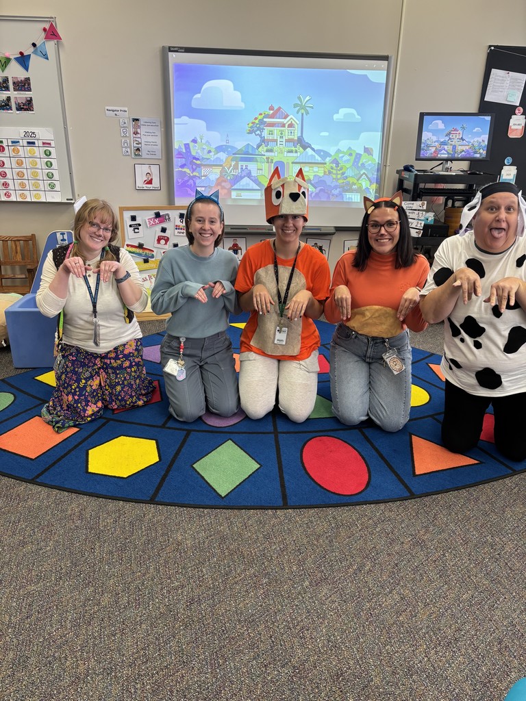 Teacher Lauren and paras dressed as Bluey!